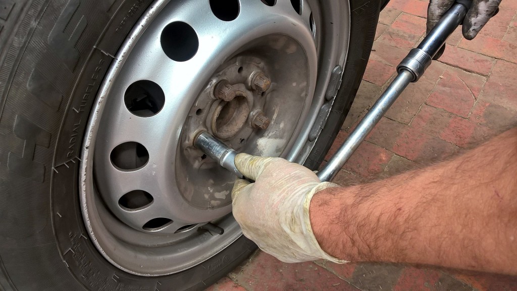Loosen the lug nuts while the car is still on the ground.